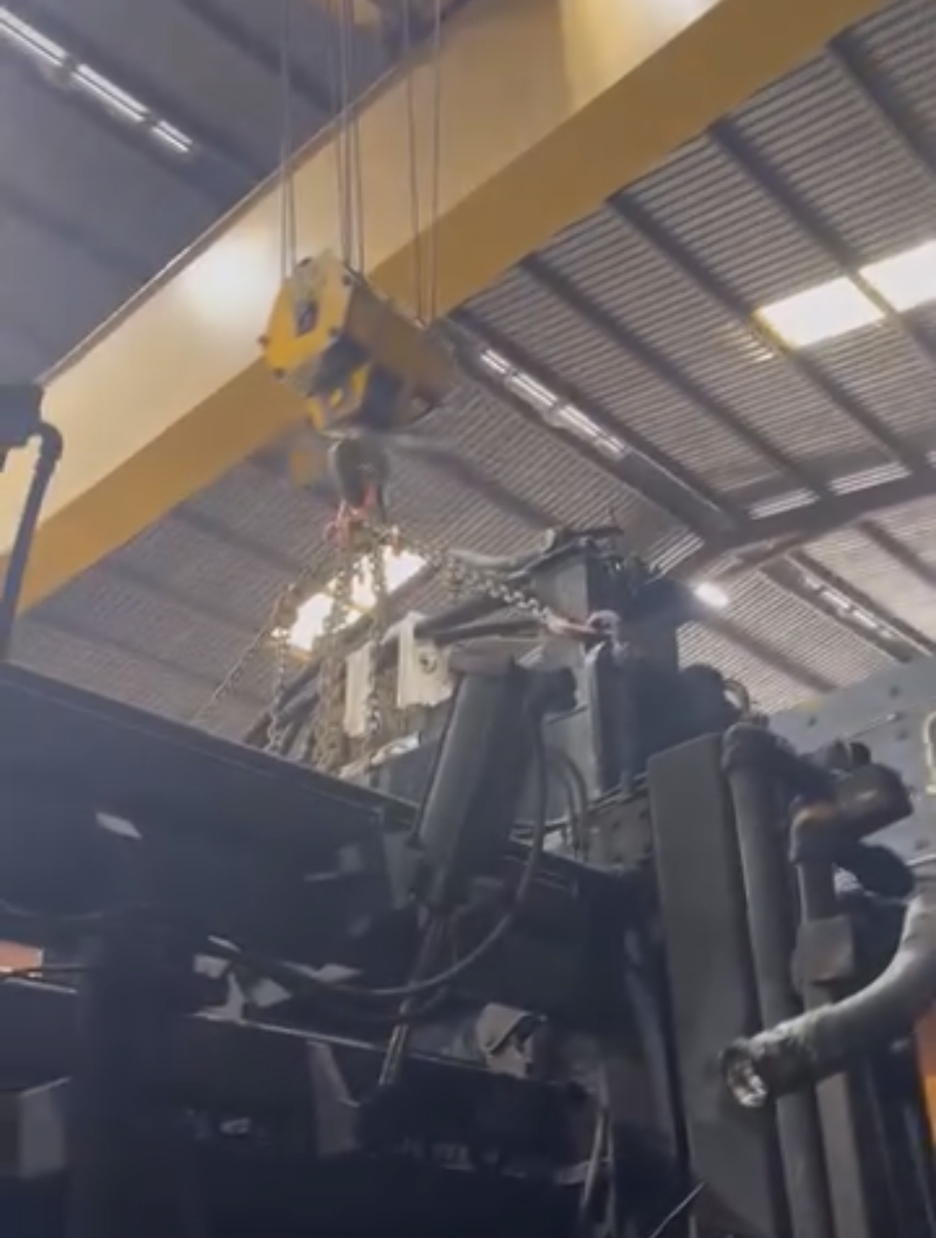 Overhead crane lifting industrial equipment